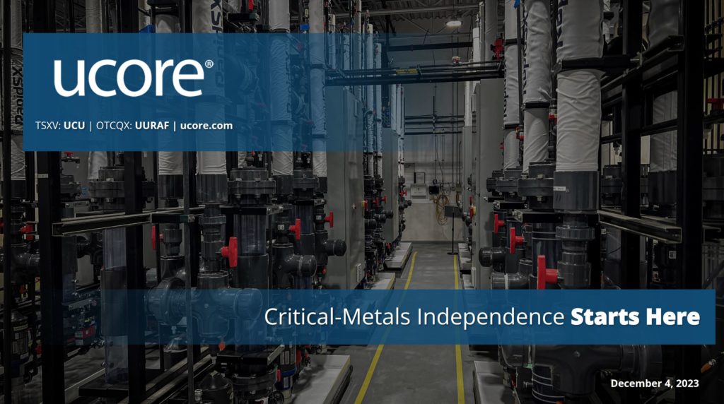 Industrieanlage mit Filterrohrsystemen, "UCORE" Logo, Text: "Critical-Metals Independence Starts Here, December 4, 2023".